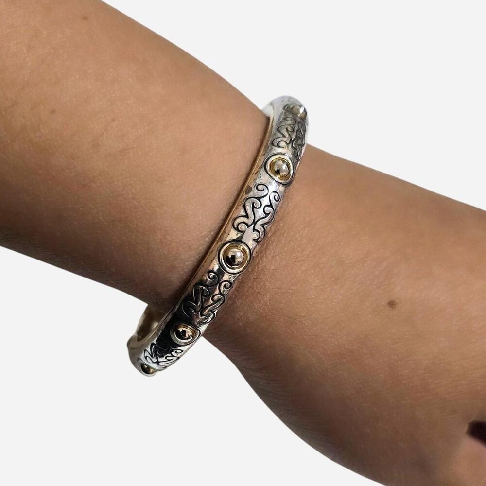 Silver bangle with gold accents
